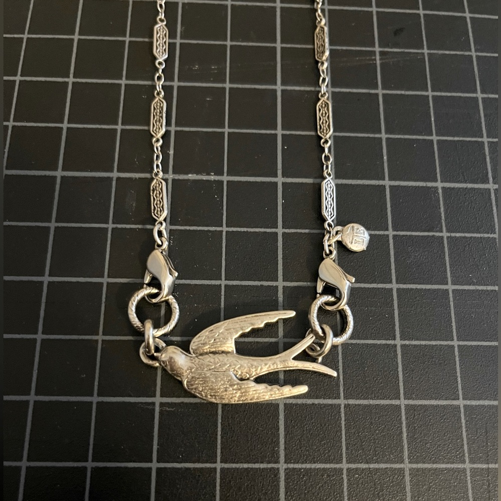 Silver toned, Lenny & Eva necklace. Includes 14 1/2 inch chain plus bird charm.